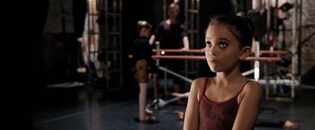 Movie still from “The Game Plan” (2007), directed by Andy Fickman – A little girl standing next to two other young ballerinas; Close Up shot, Over the shoulder angle