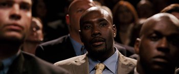 Movie still from “The Game Plan” (2007), directed by Andy Fickman – A man in a suit and a tie; Close Up shot, Over the shoulder angle