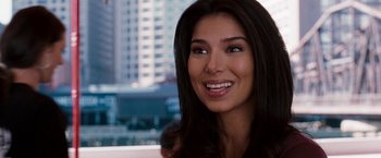 Movie still from “The Game Plan” (2007), directed by Andy Fickman – A beautiful woman with long black hair smiling for the camera; Close Up shot, Over the shoulder angle