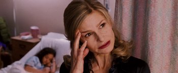 Movie still from “The Game Plan” (2007), directed by Andy Fickman – A person holding her hand to her head; Close Up shot, Over the shoulder angle