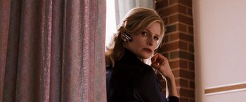 Movie still from “The Game Plan” (2007), directed by Andy Fickman – A woman is holding a cell phone up to her ear; Close Up shot, Low angle