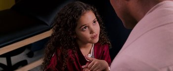 Movie still from “The Game Plan” (2007), directed by Andy Fickman – A little girl sitting in front of an older man; Close Up shot, Over the shoulder angle
