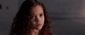 Movie still from “The Game Plan” (2007), directed by Andy Fickman – A little girl with curly hair is looking at the camera; Close Up shot, High angle
