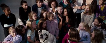 Movie still from “The Game Plan” (2007), directed by Andy Fickman – A group of young people and a dog; Wide shot, Over the shoulder angle