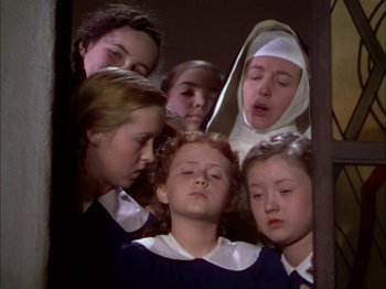 Movie still from “The Garden of Allah” (1936), directed by Richard Boleslawski – A group of young girls in a room; Medium shot, Low angle