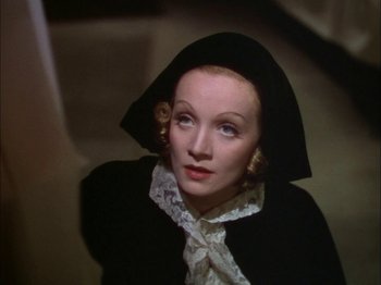 Movie still from “The Garden of Allah” (1936), directed by Richard Boleslawski – A person wearing a hat; Close Up shot, High angle