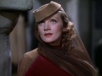Movie still from “The Garden of Allah” (1936), directed by Richard Boleslawski – A person wearing a hat and a veil; Close Up shot, Low angle