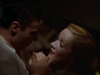 Movie still from “The Garden of Allah” (1936), directed by Richard Boleslawski – A man and a woman are holding each other; Close Up shot, High angle