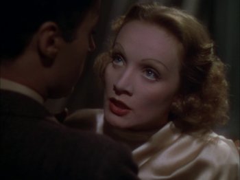 Movie still from “The Garden of Allah” (1936), directed by Richard Boleslawski – A man and a woman looking into each others eyes; Close Up shot, Over the shoulder angle