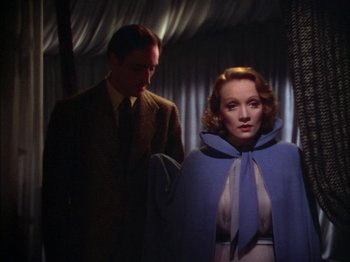 Movie still from “The Garden of Allah” (1936), directed by Richard Boleslawski – A man and a woman standing next to each other; Medium shot, Low angle