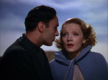 Movie still from “The Garden of Allah” (1936), directed by Richard Boleslawski – A man and a woman looking at one another; Close Up shot, Low angle