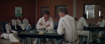 Movie still from “The Getaway” (1972), directed by Sam Peckinpah – Two men sitting at a table playing a game of chess; Close Up shot, High angle