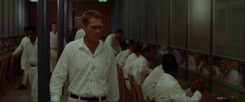 Movie still from “The Getaway” (1972), directed by Sam Peckinpah – A group of men in white shirts and white ties; Medium shot, Over the shoulder angle