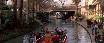 Movie still from “The Getaway” (1972), directed by Sam Peckinpah – A group of people on a boat on a river; Extreme Wide shot, High angle