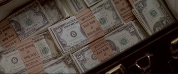 Movie still from “The Getaway” (1972), directed by Sam Peckinpah – A bunch of money bills; Extreme Close Up shot, High angle