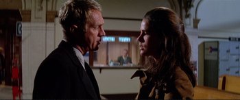 Movie still from “The Getaway” (1972), directed by Sam Peckinpah – A man and a woman are looking at one another; Close Up shot, Low angle