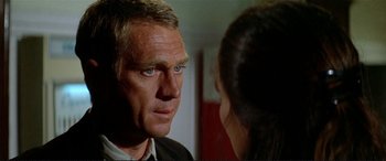 Movie still from “The Getaway” (1972), directed by Sam Peckinpah – A man and a woman talking to each other; Close Up shot, Over the shoulder angle