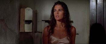 Movie still from “The Getaway” (1972), directed by Sam Peckinpah – A woman with wet hair looking at the camera; Close Up shot, Low angle