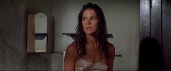 Movie still from “The Getaway” (1972), directed by Sam Peckinpah – A woman with wet hair in a room; Close Up shot, High angle