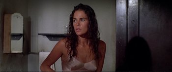 Movie still from “The Getaway” (1972), directed by Sam Peckinpah – A woman with wet hair looking at the camera; Close Up shot, High angle
