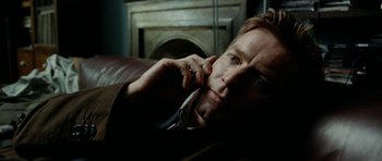 Movie still from “The Ghost Writer” (2010), directed by Roman Polanski – A person lying on a couch; Close Up shot, Low angle