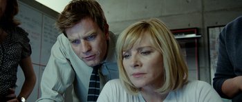 Movie still from “The Ghost Writer” (2010), directed by Roman Polanski – A man and a woman looking at the camera; Close Up shot, Low angle