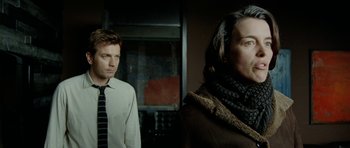 Movie still from “The Ghost Writer” (2010), directed by Roman Polanski – A man and a woman standing next to each other in a room; Close Up shot, Over the shoulder angle