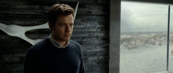 Movie still from “The Ghost Writer” (2010), directed by Roman Polanski – A person standing in a room; Close Up shot, Low angle