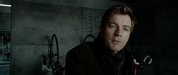 Movie still from “The Ghost Writer” (2010), directed by Roman Polanski – A person sitting in a room; Close Up shot, Over the shoulder angle