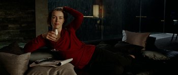Movie still from “The Ghost Writer” (2010), directed by Roman Polanski – A woman is drinking a glass of red wine; Medium shot, High angle