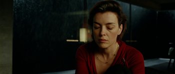 Movie still from “The Ghost Writer” (2010), directed by Roman Polanski – A person sitting in a room; Close Up shot, High angle