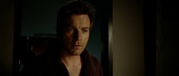 Movie still from “The Ghost Writer” (2010), directed by Roman Polanski – A person wearing a robe; Close Up shot, Over the shoulder angle