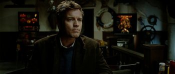 Movie still from “The Ghost Writer” (2010), directed by Roman Polanski – A person sitting in a room; Close Up shot, Over the shoulder angle