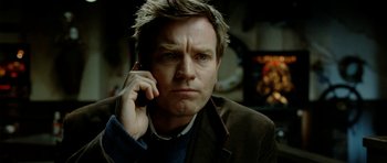 Movie still from “The Ghost Writer” (2010), directed by Roman Polanski – A person talking on a cell phone; Close Up shot, Low angle