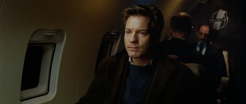 Movie still from “The Ghost Writer” (2010), directed by Roman Polanski – A person wearing a jacket and a sweater; Close Up shot, Over the shoulder angle