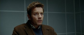 Movie still from “The Ghost Writer” (2010), directed by Roman Polanski – A person wearing a jacket; Close Up shot, Over the shoulder angle