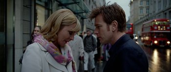 Movie still from “The Ghost Writer” (2010), directed by Roman Polanski – A man and a woman standing next to each other on the street; Close Up shot, Over the shoulder angle