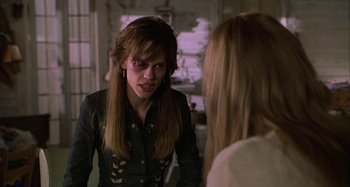 Movie still from “The Gift” (2000), directed by Sam Raimi – A woman in a black shirt is talking to another woman; Close Up shot, Over the shoulder angle