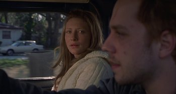 Movie still from “The Gift” (2000), directed by Sam Raimi – A woman sitting next to a man in a car; Close Up shot, Over the shoulder angle