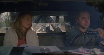 Movie still from “The Gift” (2000), directed by Sam Raimi – A man and a woman sitting in the back of a car; Medium shot, Low angle