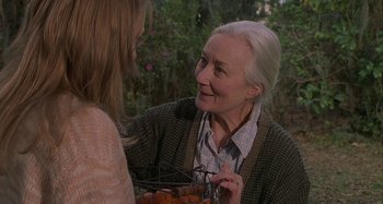 Movie still from “The Gift” (2000), directed by Sam Raimi – A woman and an older woman holding a basket of tomatoes; Medium shot, Over the shoulder angle