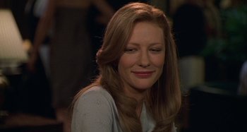 Movie still from “The Gift” (2000), directed by Sam Raimi – A person with long brown hair; Close Up shot, Over the shoulder angle