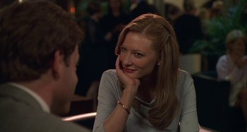 Movie still from “The Gift” (2000), directed by Sam Raimi – A beautiful young lady sitting next to a man in a restaurant; Close Up shot, Over the shoulder angle