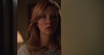 Movie still from “The Gift” (2000), directed by Sam Raimi – A beautiful young woman with long red hair looking to her left; Close Up shot, Low angle