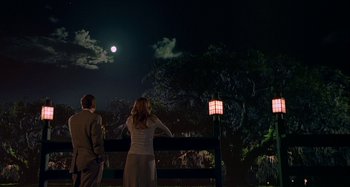 Movie still from “The Gift” (2000), directed by Sam Raimi – Two people are looking at the moon at night; Wide shot, Low angle