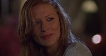 Movie still from “The Gift” (2000), directed by Sam Raimi – A person with long red hair; Close Up shot, Over the shoulder angle