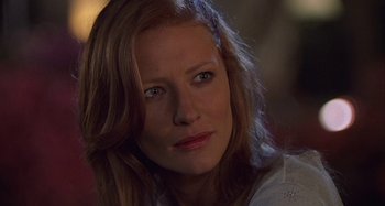 Movie still from “The Gift” (2000), directed by Sam Raimi – A person with long hair; Close Up shot, Over the shoulder angle