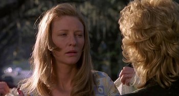 Movie still from “The Gift” (2000), directed by Sam Raimi – A woman with long blonde hair talking to another woman; Close Up shot, Over the shoulder angle