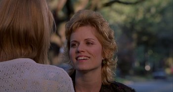 Movie still from “The Gift” (2000), directed by Sam Raimi – A person with long blonde hair; Close Up shot, Over the shoulder angle