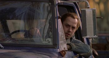 Movie still from “The Gift” (2000), directed by Sam Raimi – A man sitting in the driver's seat of an airplane; Close Up shot, Low angle